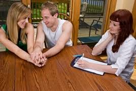 Young homeowners holding hands